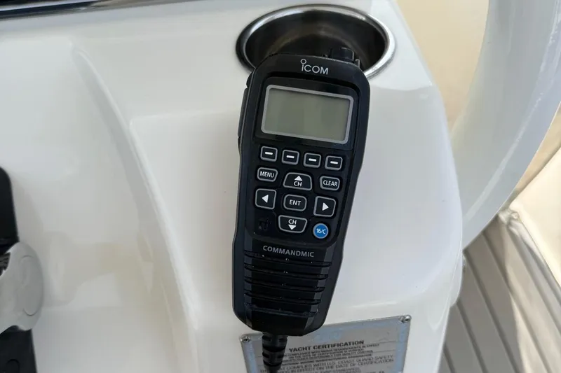Slide: The Image of ICOM CommandMic on 2019 Cobia 277 Center Console boat dashboard. - 11