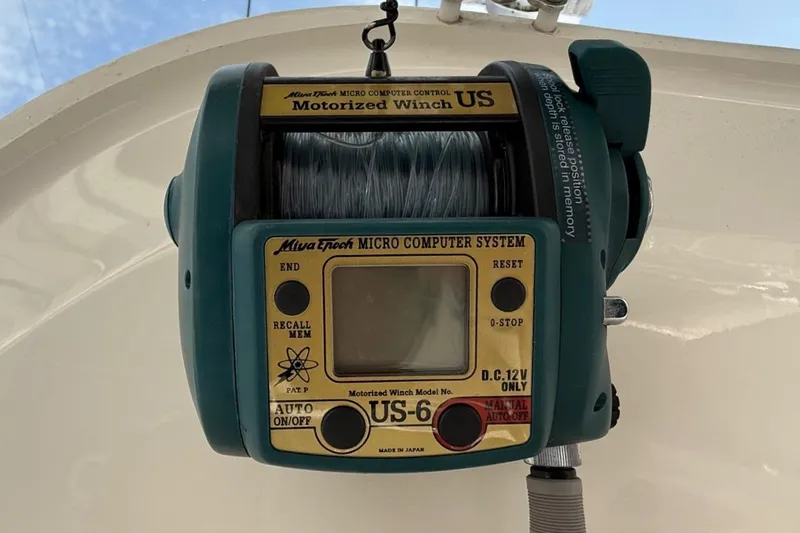 Slide: The Image of Motorized winch on 2019 Cobia 277 Center Console boat, featuring microcomputer system. - 21