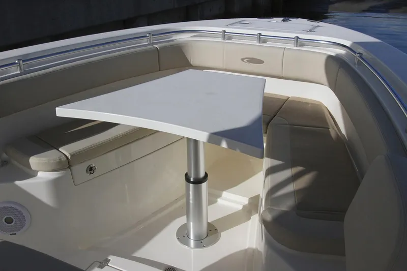Slide: The Image of Manufacturer Provided Image: 2019 Cobia 277 Center Console boat with seating area and table. - 31