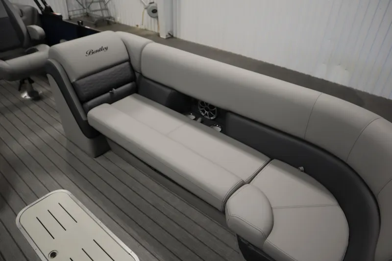 Slide: The Image of 2025 Bentley Pontoons Elite 253 Admiral Tri-toon interior seating, featuring luxurious gray upholstery. - 11