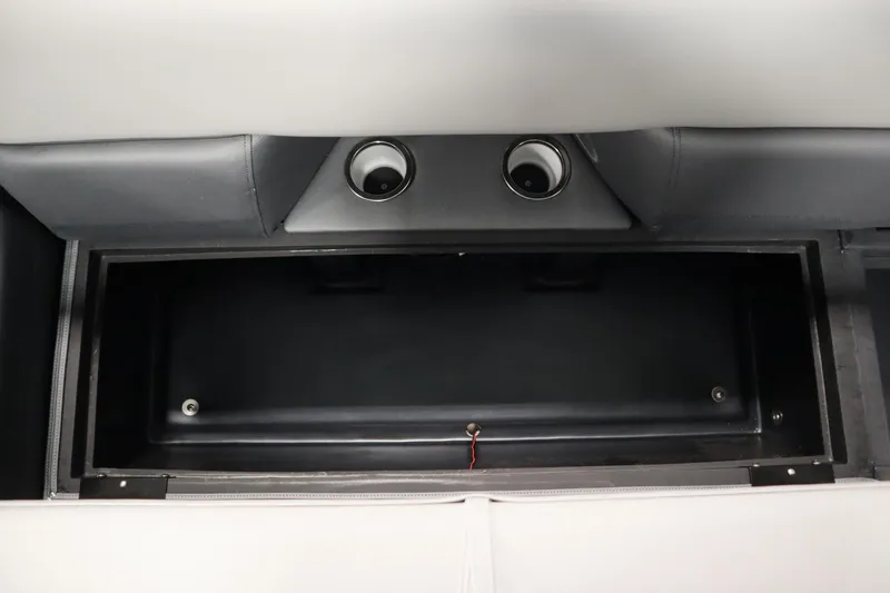 Slide: The Image of 2025 Bentley Pontoons Elite 253 Admiral Tri-toon storage compartment with cup holders. - 13