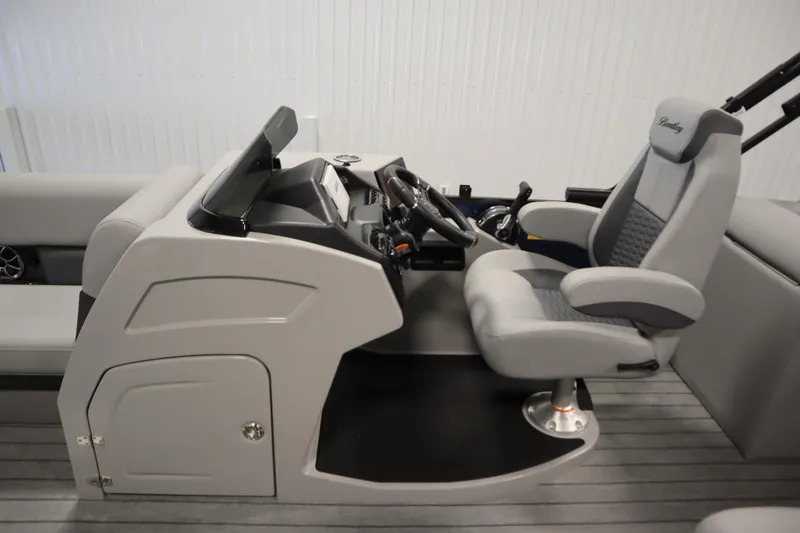 Slide: The Image of 2025 Bentley Pontoons Elite 253 Admiral Tri-toon helm with modern steering and seating. - 20