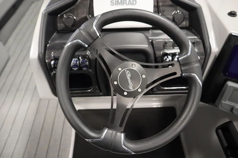 Slide: The Image of 2025 Bentley Pontoons Elite 253 Admiral Tri-toon steering wheel and dashboard detail. - 23