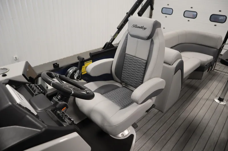 Slide: The Image of 2025 Bentley Pontoons Elite 253 Admiral Tri-toon interior with luxurious seating and modern helm. - 32