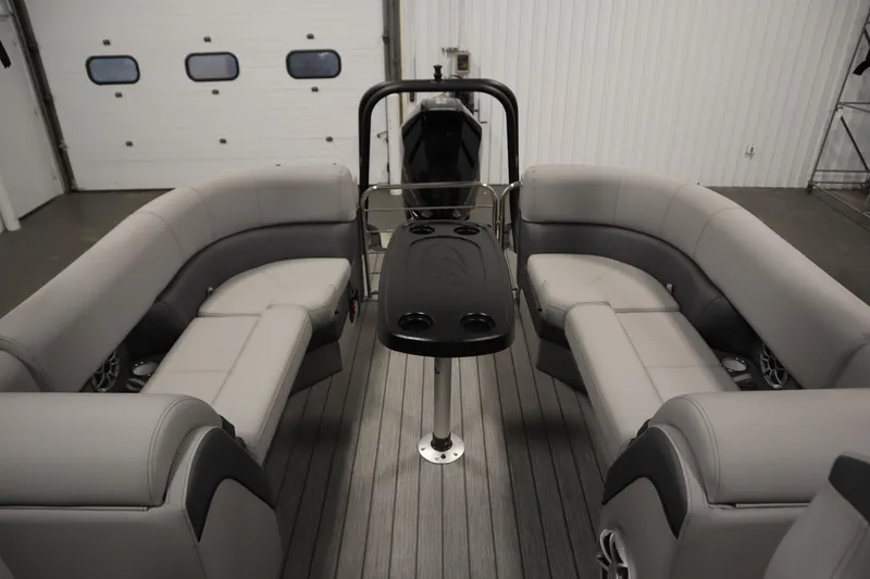 Slide: The Image of 2025 Bentley Pontoons Elite 253 Admiral Tri-toon interior with luxurious seating and table. - 34