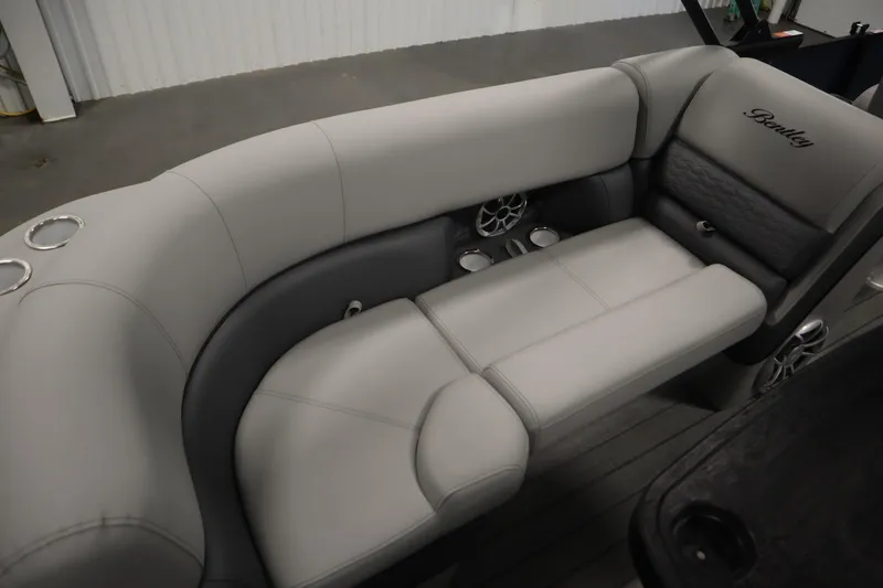 Slide: The Image of Luxurious seating in 2025 Bentley Pontoons Elite 253 Admiral Tri-toon, featuring cup holders and speakers. - 35