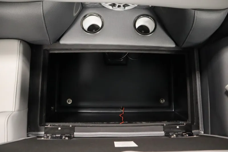 Slide: The Image of 2025 Bentley Pontoons Elite 253 Admiral Tri-toon storage compartment with cup holders. - 37