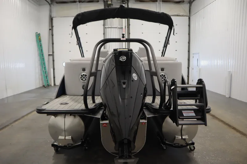 Slide: The Image of 2025 Bentley Pontoons Elite 253 Admiral Tri-toon in a garage, rear view. - 5