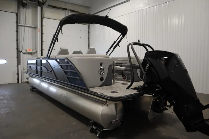 Slide: The Image of 2025 Bentley Pontoons Elite 253 Admiral Tri-toon in indoor storage, showcasing sleek design. - 6