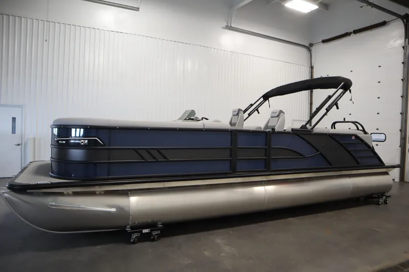 Slide: The Image of 2025 Bentley Pontoons Elite 253 Admiral Tri-toon in a showroom setting. - 7