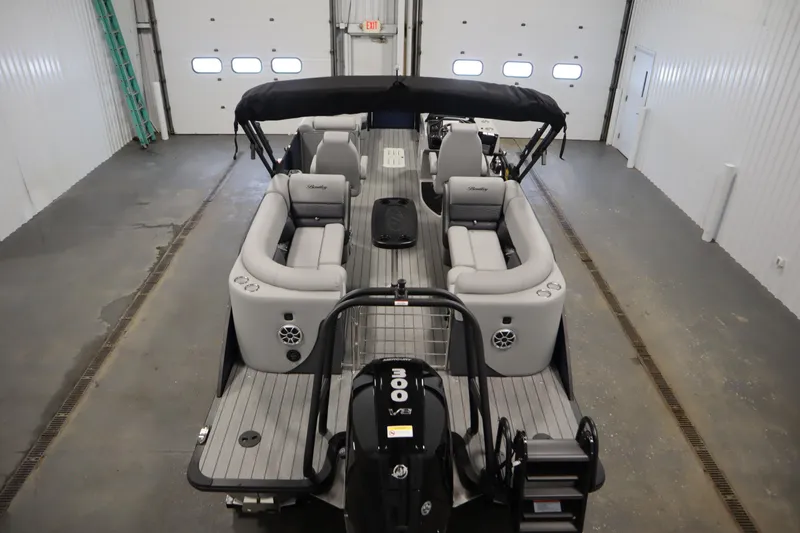 Slide: The Image of 2025 Bentley Pontoons Elite 253 Admiral Tri-toon in a spacious indoor setting. - 9