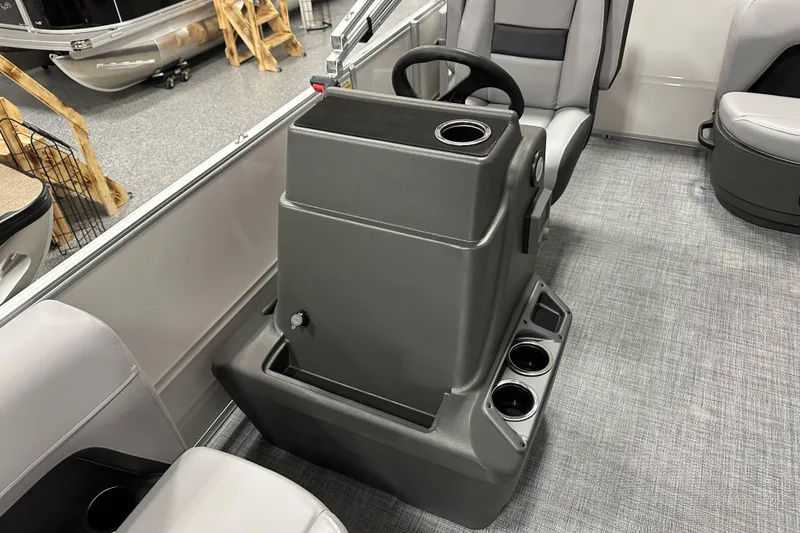 Slide: The Image of 2026 Sun Tracker Party Barge 16 DLX interior with steering console and seating. - 10