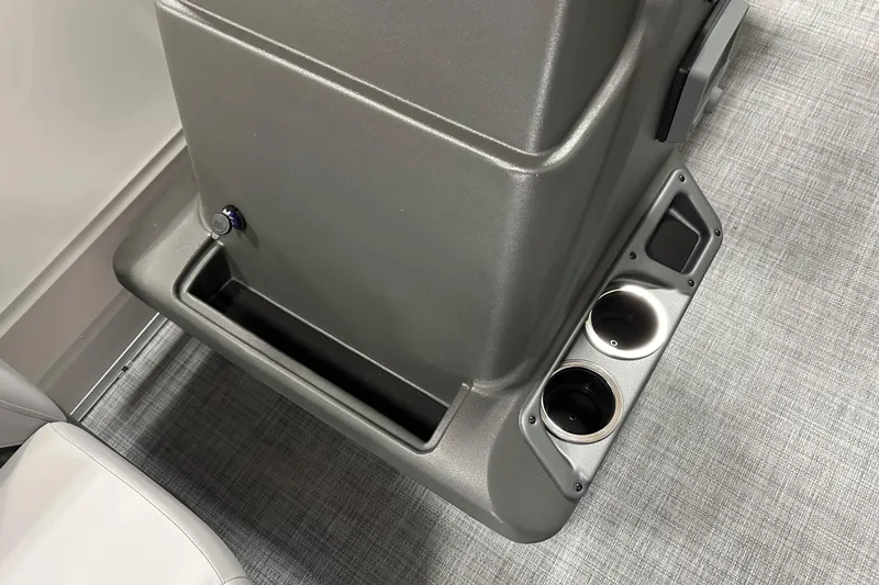 Slide: The Image of 2026 Sun Tracker Party Barge 16 DLX console with cup holders and storage compartment. - 11