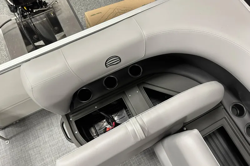 Slide: The Image of 2026 Sun Tracker Party Barge 16 DLX interior seating and storage compartments. - 14