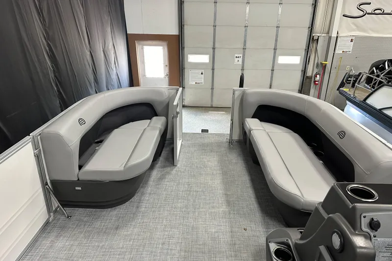 Slide: The Image of 2026 Sun Tracker Party Barge 16 DLX interior with gray seating and modern design. - 6
