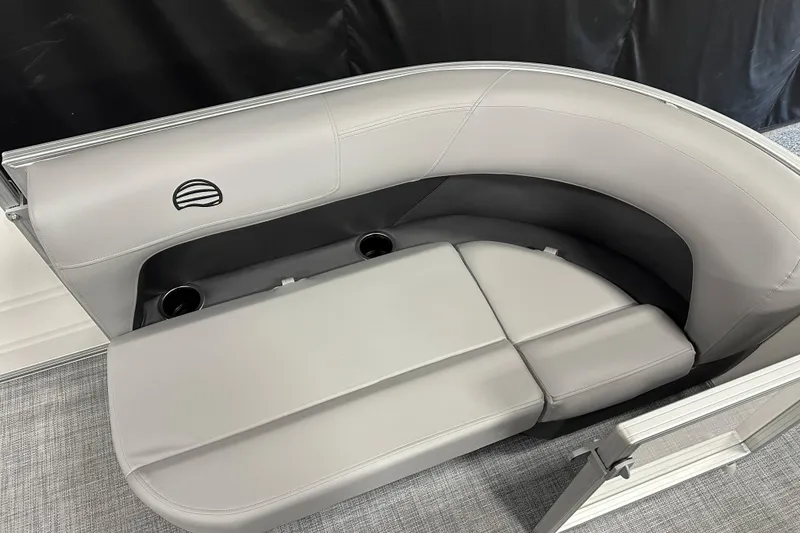 Slide: The Image of 2026 Sun Tracker Party Barge 16 DLX interior seating with cup holders and sleek design. - 8