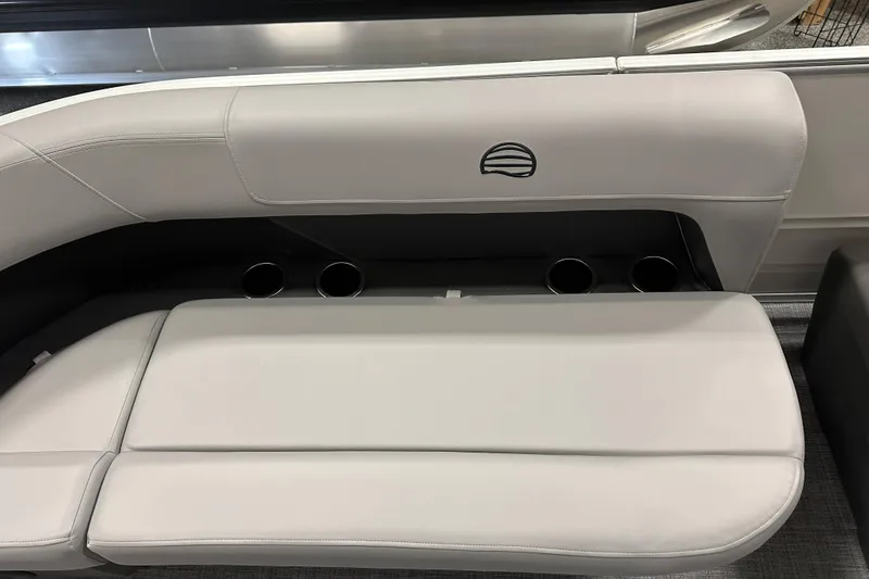 Slide: The Image of 2026 Sun Tracker Party Barge 16 DLX seating with cup holders, light gray upholstery. - 9