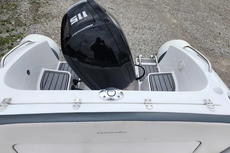 Slide: The Image of 2022 Walker Bay Generation 525 DLX boat with Mercury outboard motor, rear view. - 11
