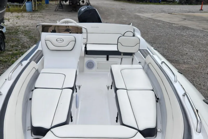 Slide: The Image of 2022 Walker Bay Generation 525 DLX boat interior with white seating and sleek design. - 3