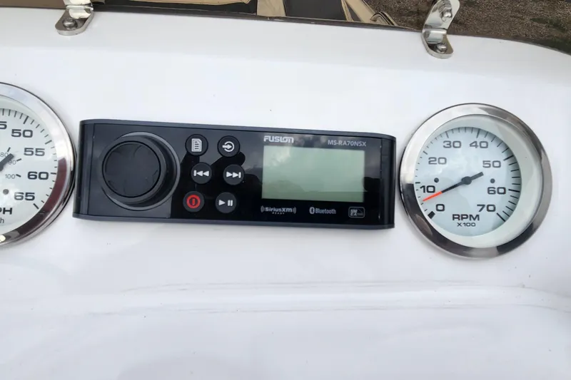 Slide: The Image of Dashboard of 2022 Walker Bay Generation 525 DLX with speedometer and RPM gauge. - 9