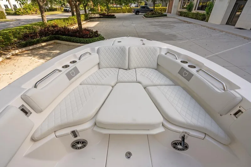 Slide: The Image of 2025 Sea Fox 228 Commander boat with luxurious white seating and cup holders. - 8