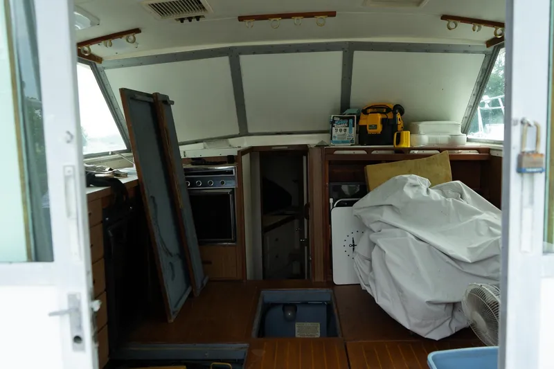 Slide: The Image of 1978 Bertram 35 Flybridge Sportfish interior with equipment and storage. - 18
