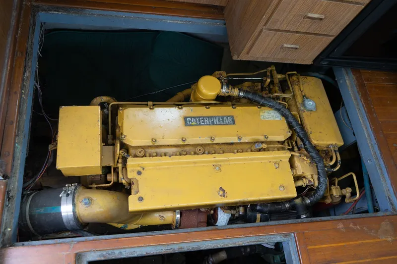 Slide: The Image of Yellow Caterpillar engine in a 1978 Bertram 35 Flybridge Sportfish boat. - 22