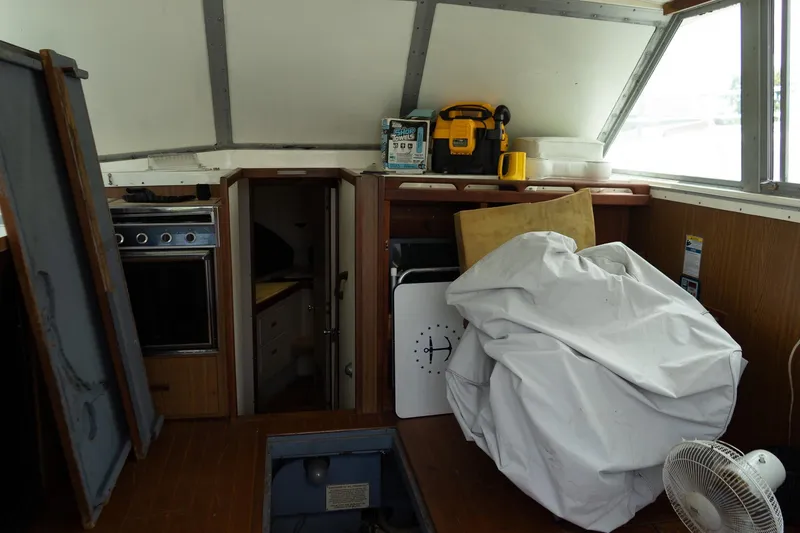 Slide: The Image of 1978 Bertram 35 Flybridge Sportfish interior with storage and equipment. - 25