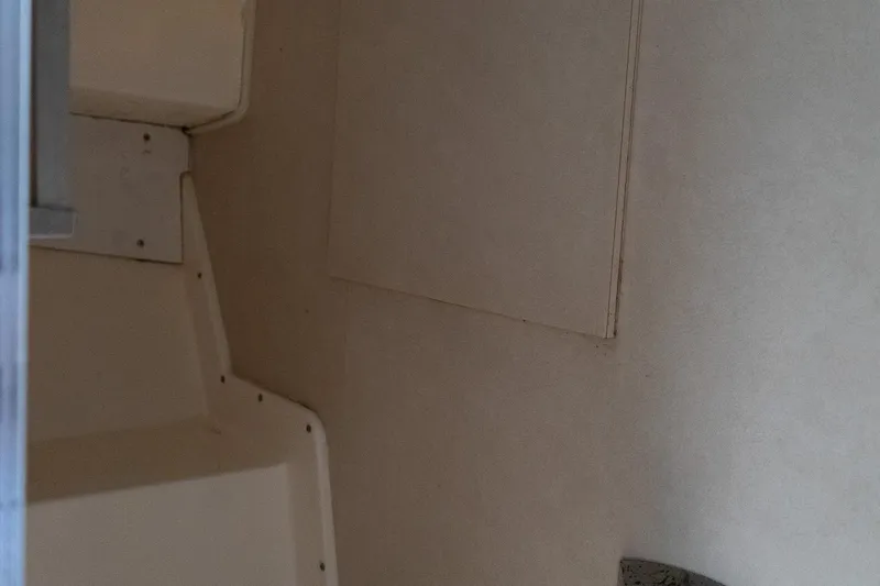 Slide: The Image of Interior view of a 1978 Bertram 35 Flybridge Sportfish boat, showcasing seating and wall details. - 36