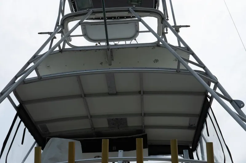 Slide: The Image of 1978 Bertram 35 Flybridge Sportfish, view of the flybridge structure from below. - 6