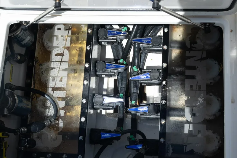 Slide: The Image of Engine compartment of 2023 Contender 44 ST boat, showcasing mechanical components. - 10