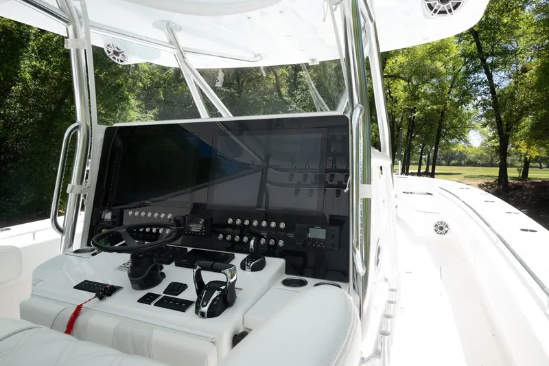 Slide: The Image of 2023 Contender 44 ST boat cockpit with advanced navigation system and sleek design. - 2