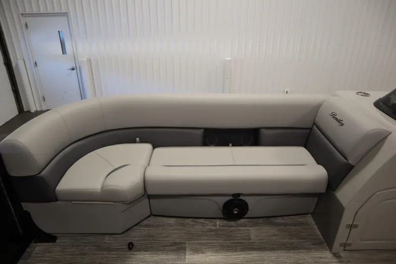 Slide: The Image of 2025 Bentley Pontoons Legacy 243 DL Navigator Tri-toon interior seating, featuring luxurious gray upholstery. - 12