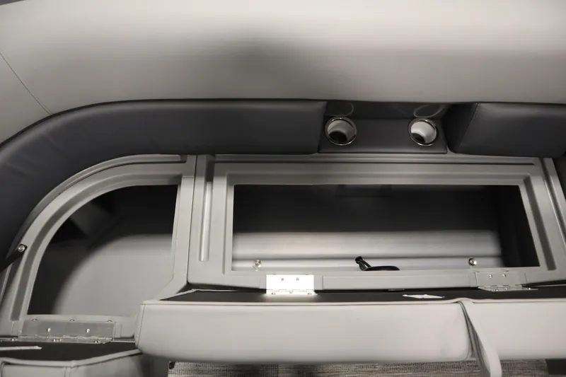 Slide: The Image of 2025 Bentley Pontoons Legacy 243 DL Navigator Tri-toon interior storage compartment with cup holders. - 13