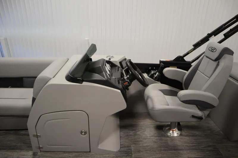 Slide: The Image of 2025 Bentley Pontoons Legacy 243 DL Navigator Tri-toon interior with captain's chair and console. - 14