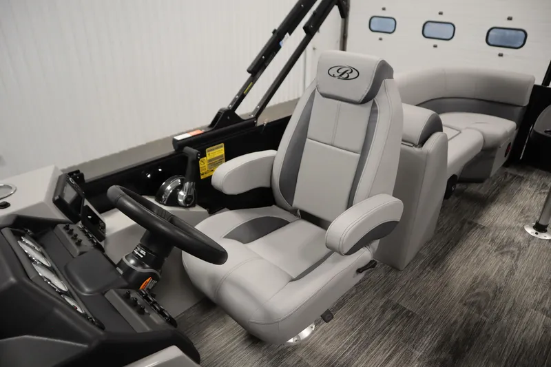 Slide: The Image of 2025 Bentley Pontoons Legacy 243 DL Navigator Tri-toon interior with luxurious seating and modern controls. - 25