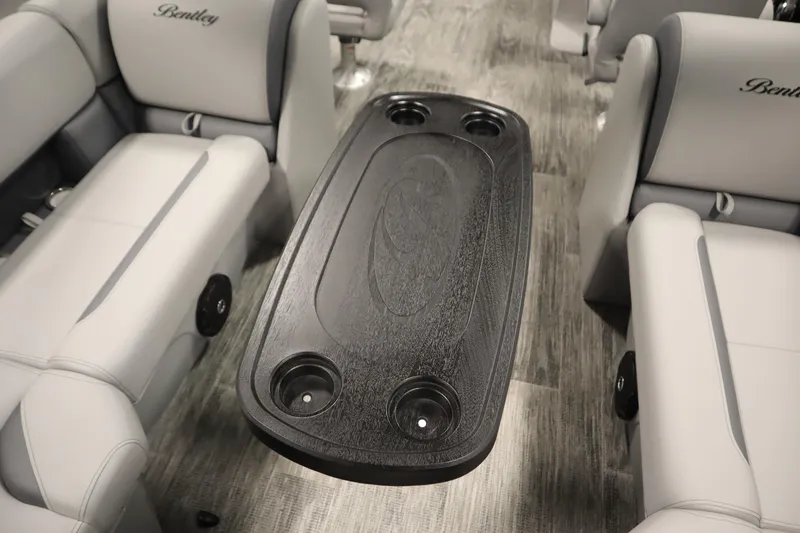 Slide: The Image of 2025 Bentley Pontoons Legacy 243 DL Navigator interior with seating and table. - 33