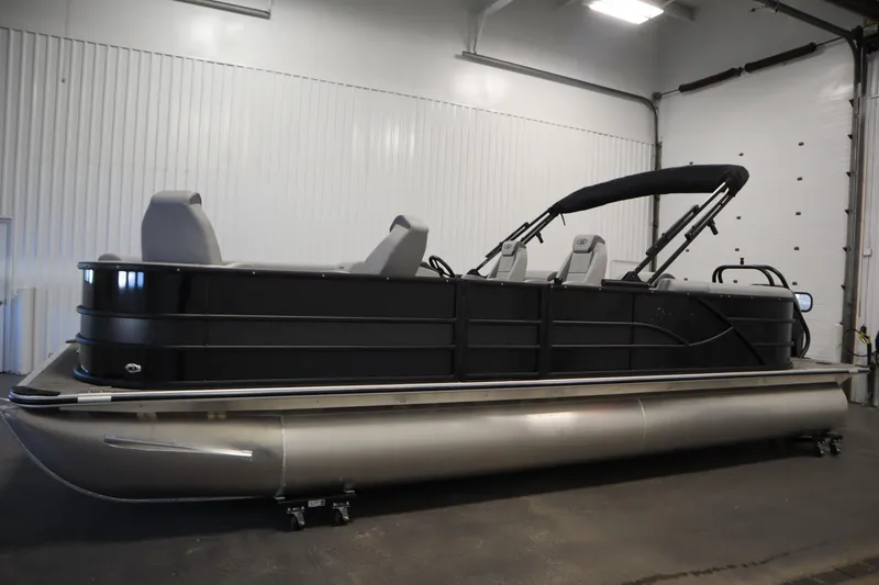 Slide: The Image of 2025 Bentley Pontoons Legacy 243 DL Navigator Tri-toon in a showroom setting. - 7