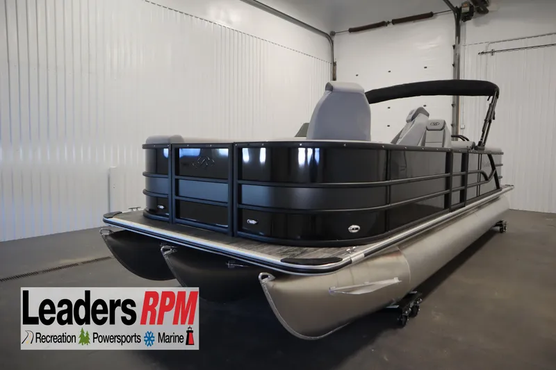 The Image of 2025 Bentley Pontoons Legacy 243 DL Navigator Tri-toon in showroom, sleek design, black finish. - 0