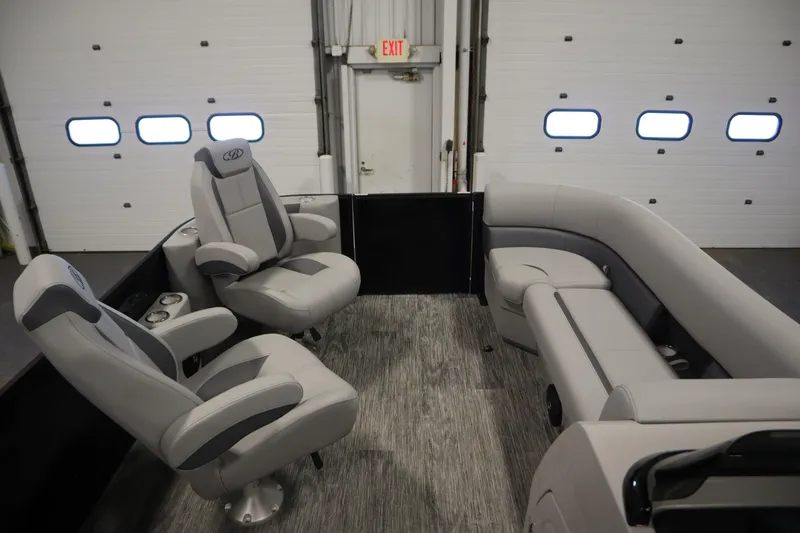Slide: The Image of 2025 Bentley Pontoons Legacy 243 DL Navigator Tri-toon interior seats, featuring luxurious gray upholstery. - 10