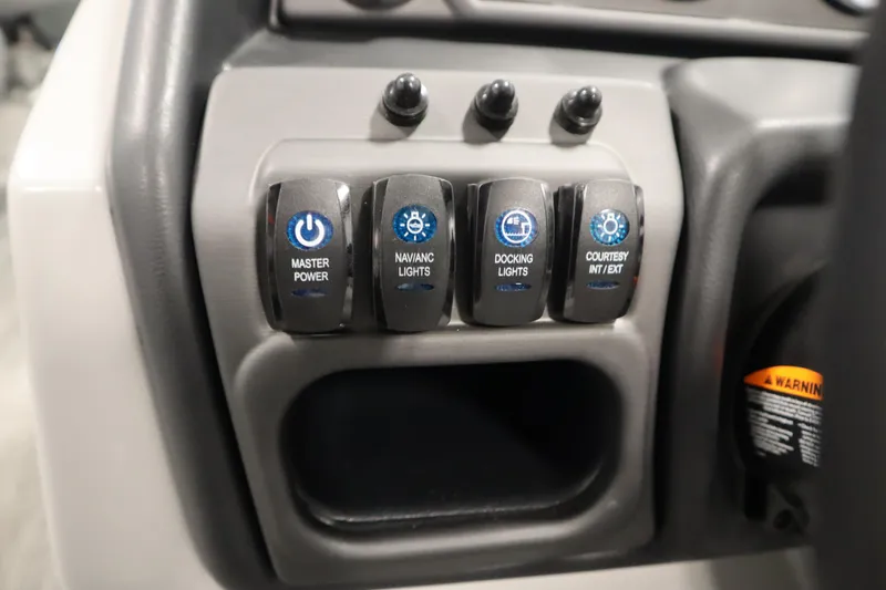 Slide: The Image of Dashboard of 2025 Bentley Pontoons Legacy 243 DL Navigator Tri-toon with gauges and controls. - 19