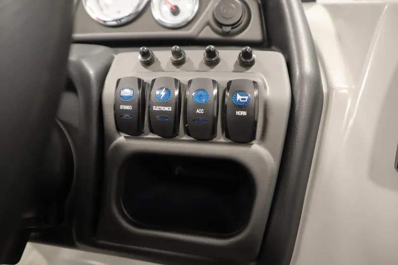 Slide: The Image of Control panel of 2025 Bentley Pontoons Legacy 243 DL Navigator Tri-toon with labeled switches. - 20