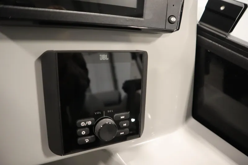 Slide: The Image of Control panel of 2025 Bentley Pontoons Legacy 243 DL Navigator Tri-toon with labeled switches. - 22