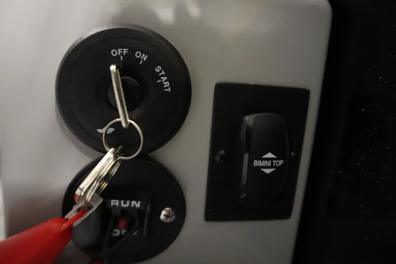 Slide: The Image of 2025 Bentley Pontoons Legacy 243 DL Navigator Tri-toon interior with luxurious seating and modern controls. - 24