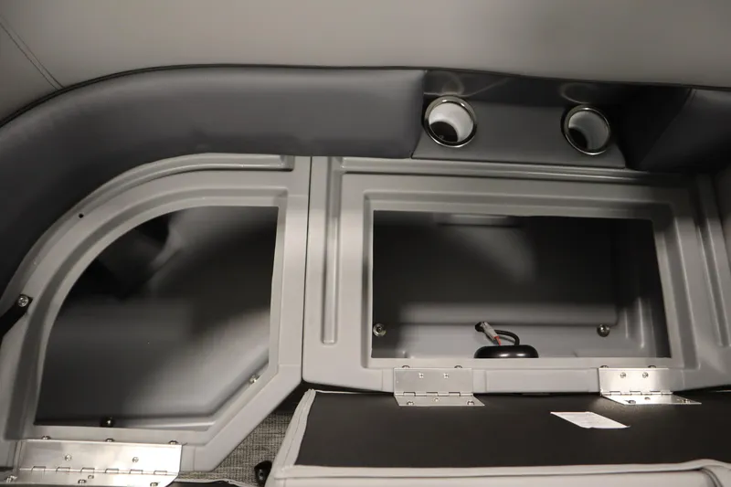 Slide: The Image of 2025 Bentley Pontoons Legacy 243 DL Navigator Tri-toon interior with gray seating and table. - 29