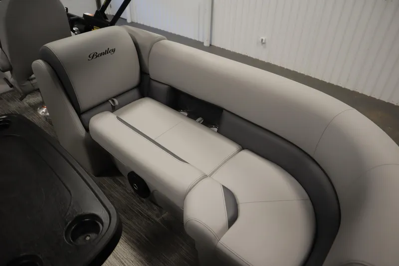Slide: The Image of 2025 Bentley Pontoons Legacy 243 DL Navigator Tri-toon interior seating, featuring luxurious gray upholstery. - 30