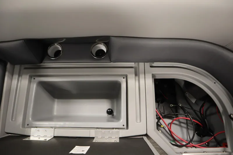 Slide: The Image of 2025 Bentley Pontoons Legacy 243 DL Navigator Tri-toon with Mercury outboard motor in a garage. - 32