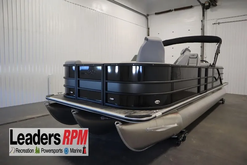 Slide: The Image of 2025 Bentley Pontoons Legacy 243 DL Navigator Tri-toon in showroom, Leaders RPM logo visible. - 42