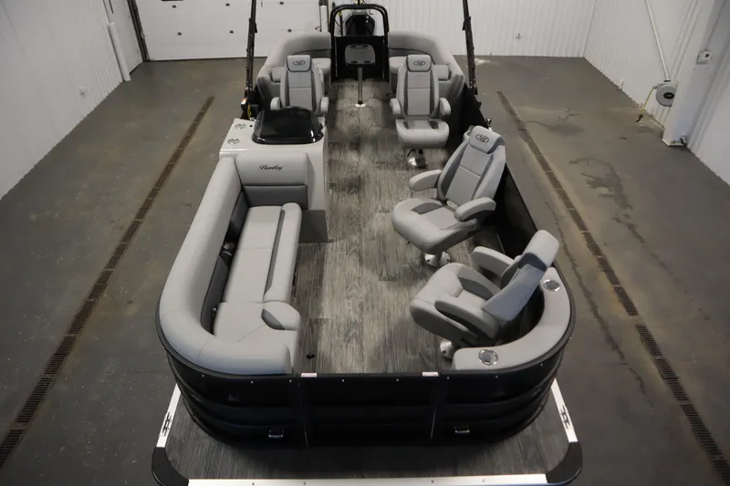 Slide: The Image of 2025 Bentley Pontoons Legacy 243 DL Navigator Tri-toon interior with luxurious seating arrangement. - 8