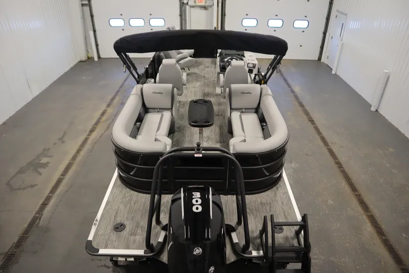 Slide: The Image of 2025 Bentley Pontoons Legacy 243 DL Navigator Tri-toon interior seating, featuring luxurious gray upholstery. - 9